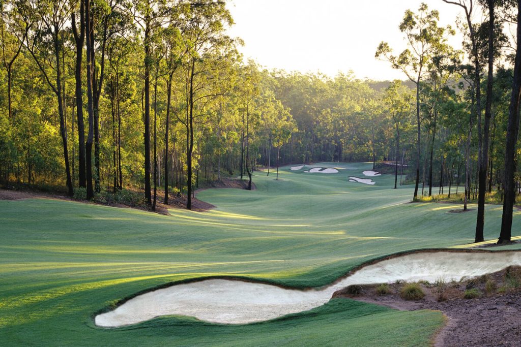 A golf fairway at dusk.